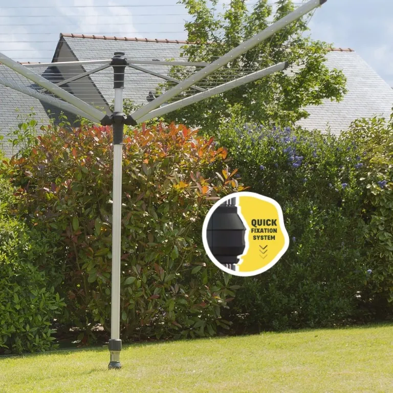 étendoir à linge parapluie fixé solidement dans un pied pour mât droit inséré dans une base d’ancrage, installation stable et pratique